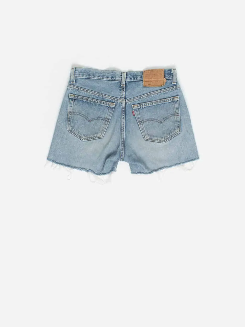 Vintage Levis 501 cut off denim shorts in stonewash blue. Made in USA – Medium